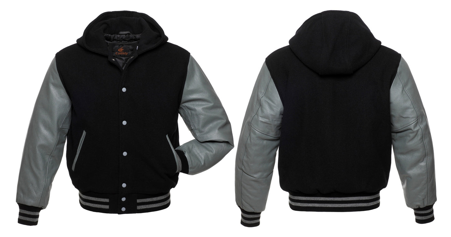 Black bomber varsity jacket with gray leather sleeves.